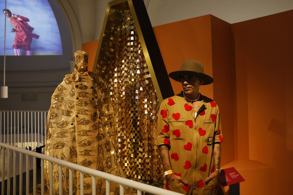 African Fashion: Moroccan fashion designer Artsi Ifrach poses for a photograph next to his creation, A Dialogue Between Cultures
